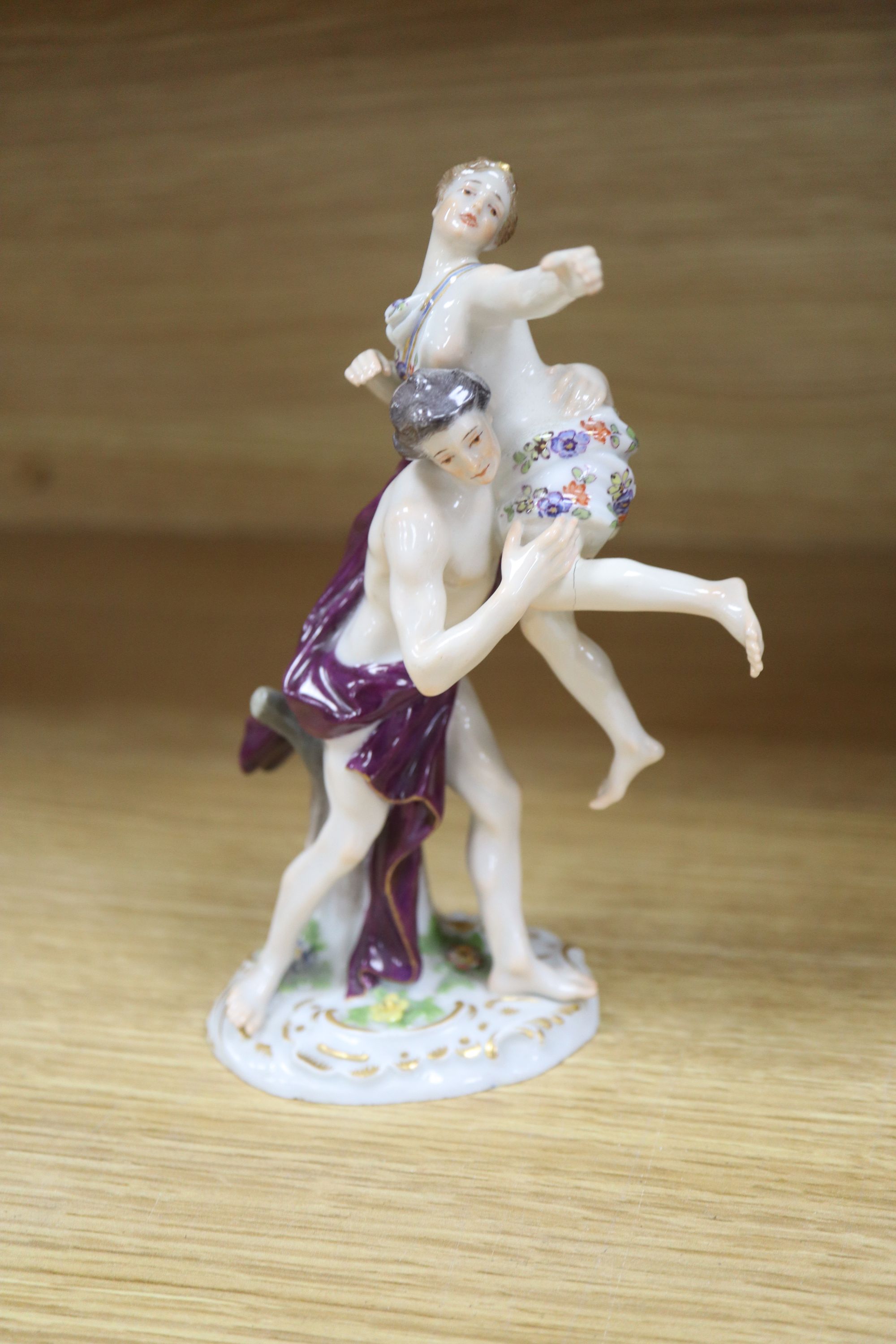 A late Meissen group, Rape of the Sabine Women, painted blue marks and incised number 1919